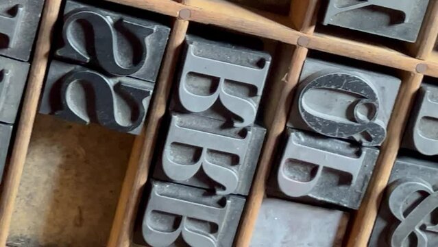 Lead type stored in a traditional wooden type case